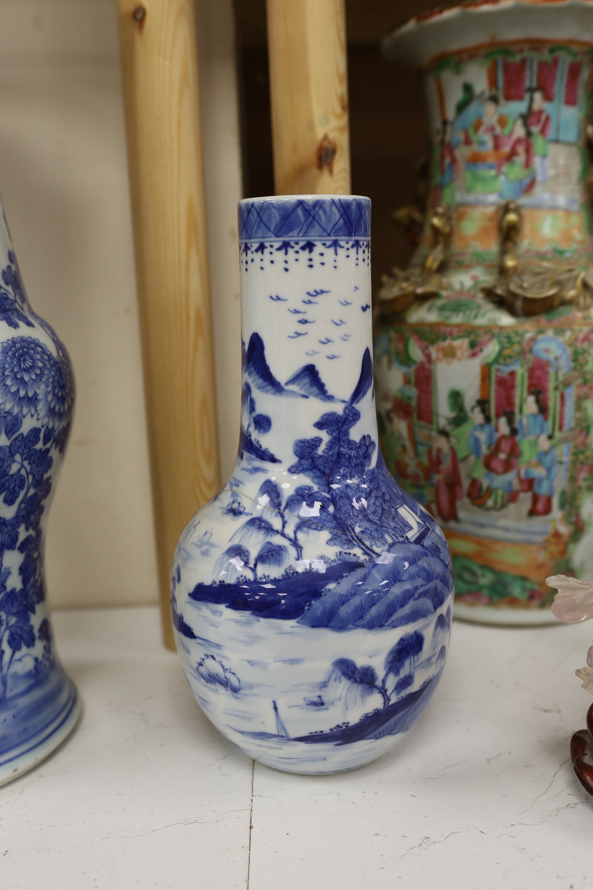 A pair of Chinese Canton decorated famille rose enamelled vases, 36cm high